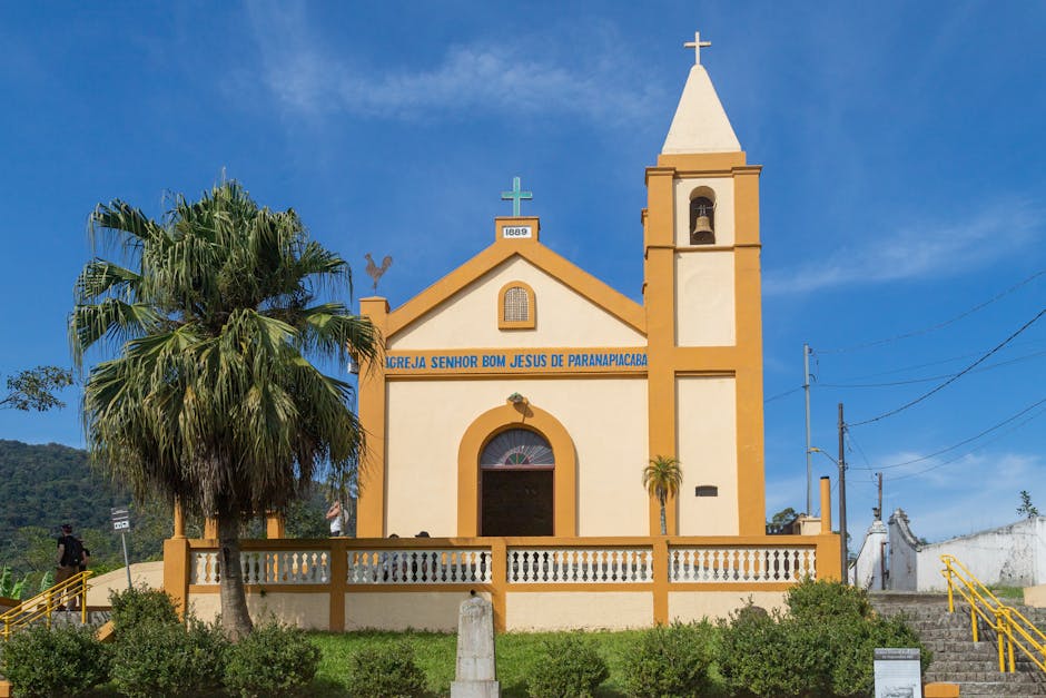 Front view of a historic church in Paranapiacaba with clear blue skies.