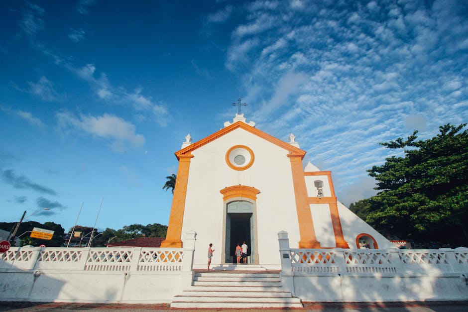 Scenic view of a historic church in Florianópolis, Brazil with a vibrant blue sky backdrop.