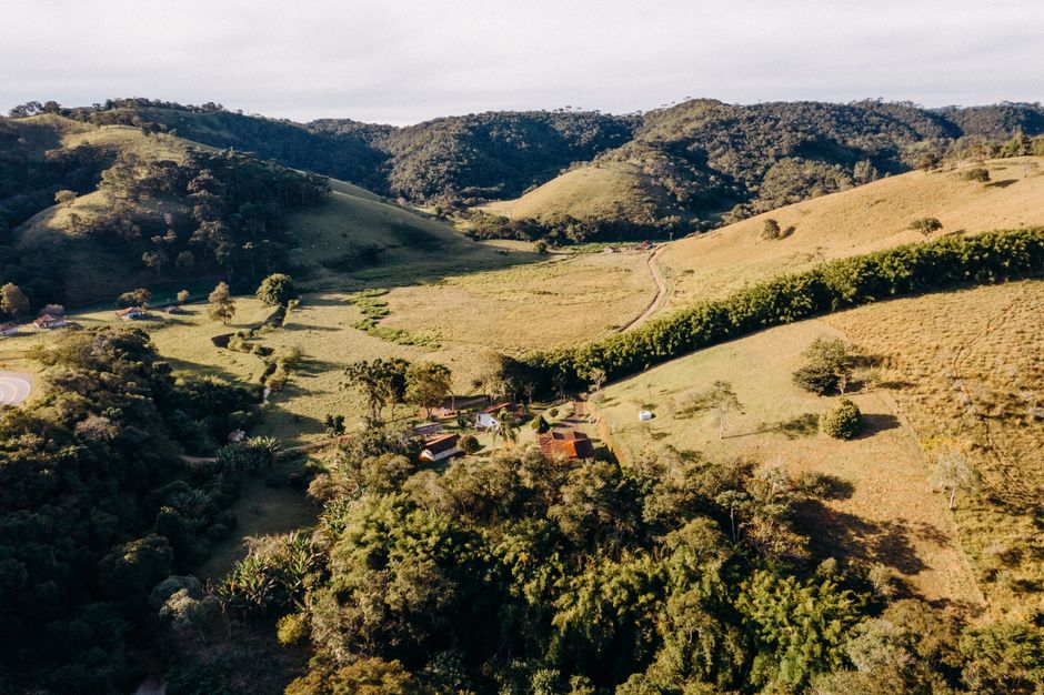 Aerial view of lush green rolling hills in Santo Antônio do Pinhal, Brazil.