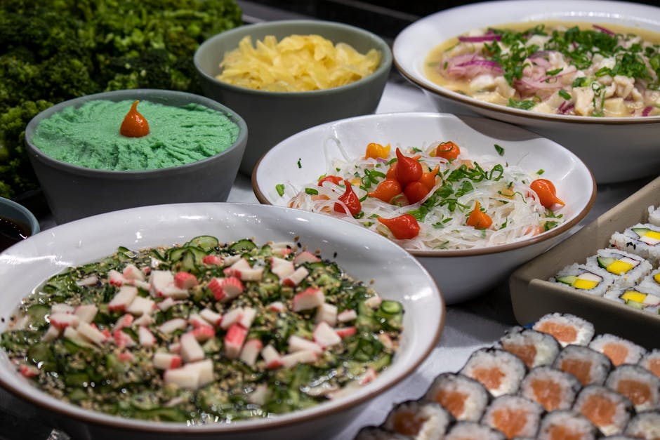 A vibrant array of Japanese dishes, including sushi and salads, artfully presented for a delicious feast.