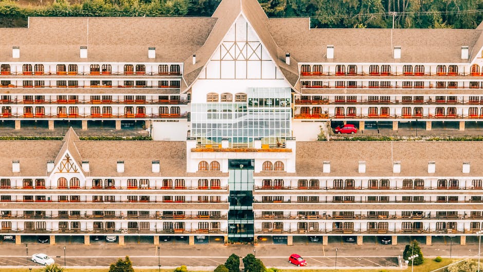 Aerial shot of a luxurious mountain hotel with European architectural style in Campos do Jordão, Brazil.