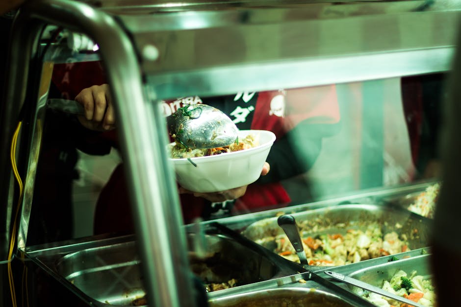 A close-up of food being served in a popular São Paulo food stand, showcasing vibrant ingredients.