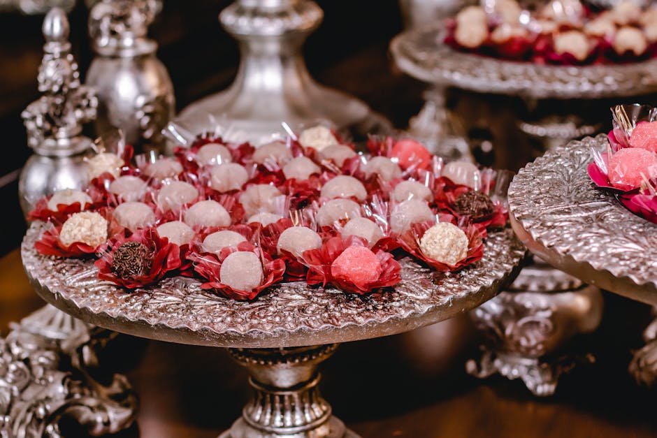 Luxurious display of assorted Brazilian brigadeiros on ornate silver trays, perfect for celebrations.