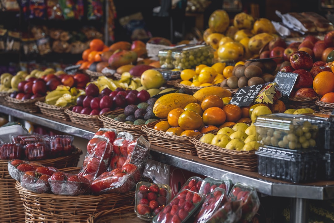 yellow and red apples on brown woven baskets