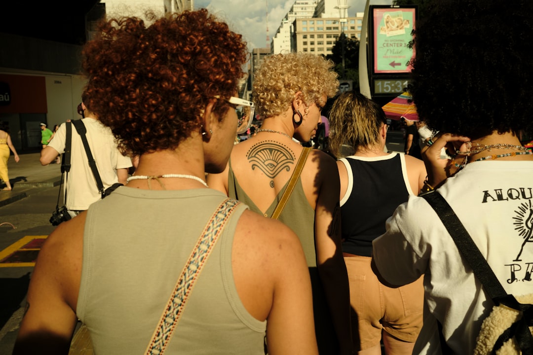 a group of people standing around each other
