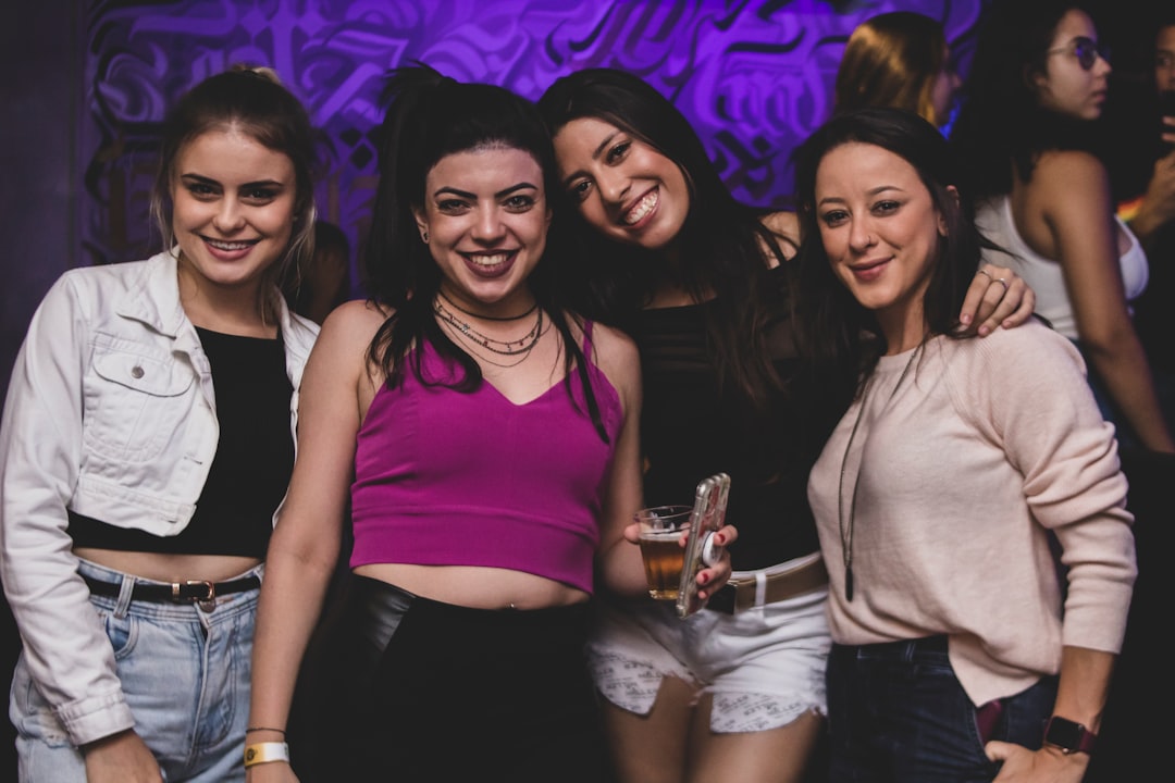 a group of women standing next to each other