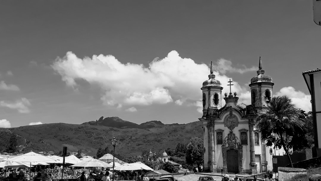 concrete church under cloudy sky