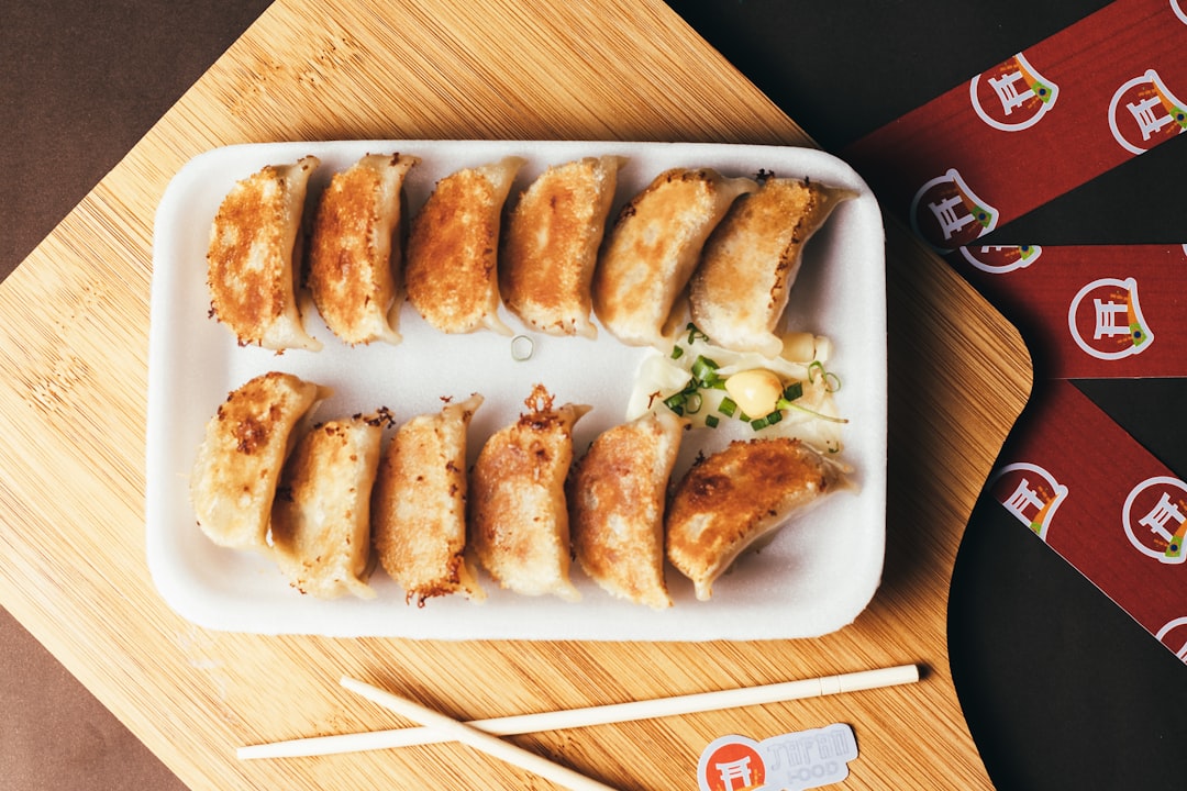 a plate of food on a table with chopsticks