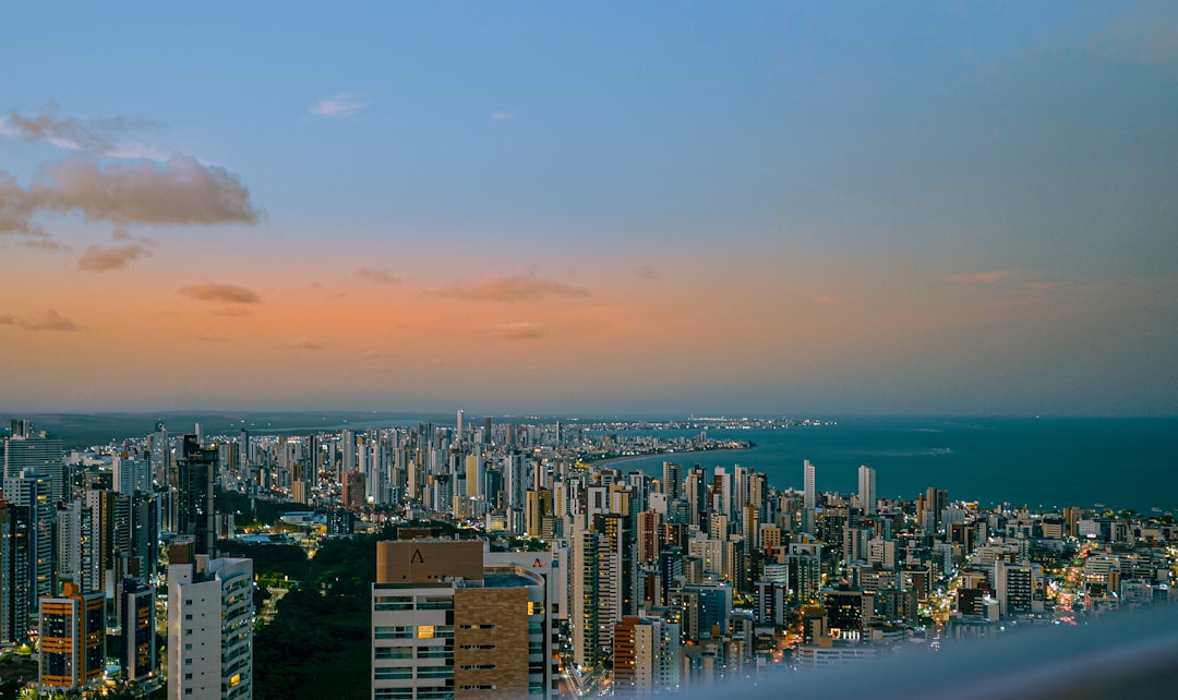 Cityscape overlooking the ocean at dusk