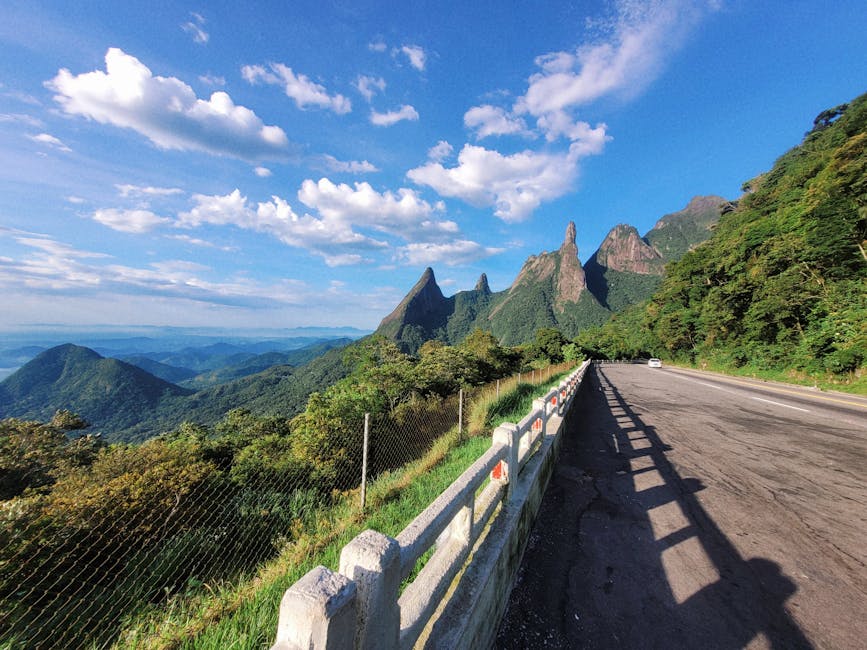 Majestic mountain view from a highway in Brazil under a clear blue sky.