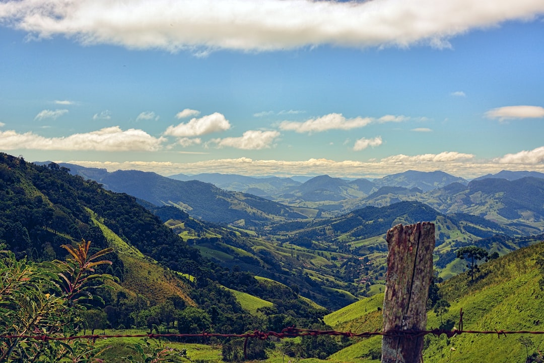a view of a valley with mountains in the background