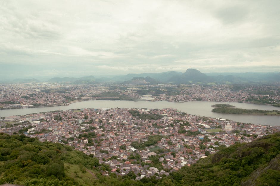 Stunning aerial view of Vitoria, ES, Brazil with lush greenery and water bodies.